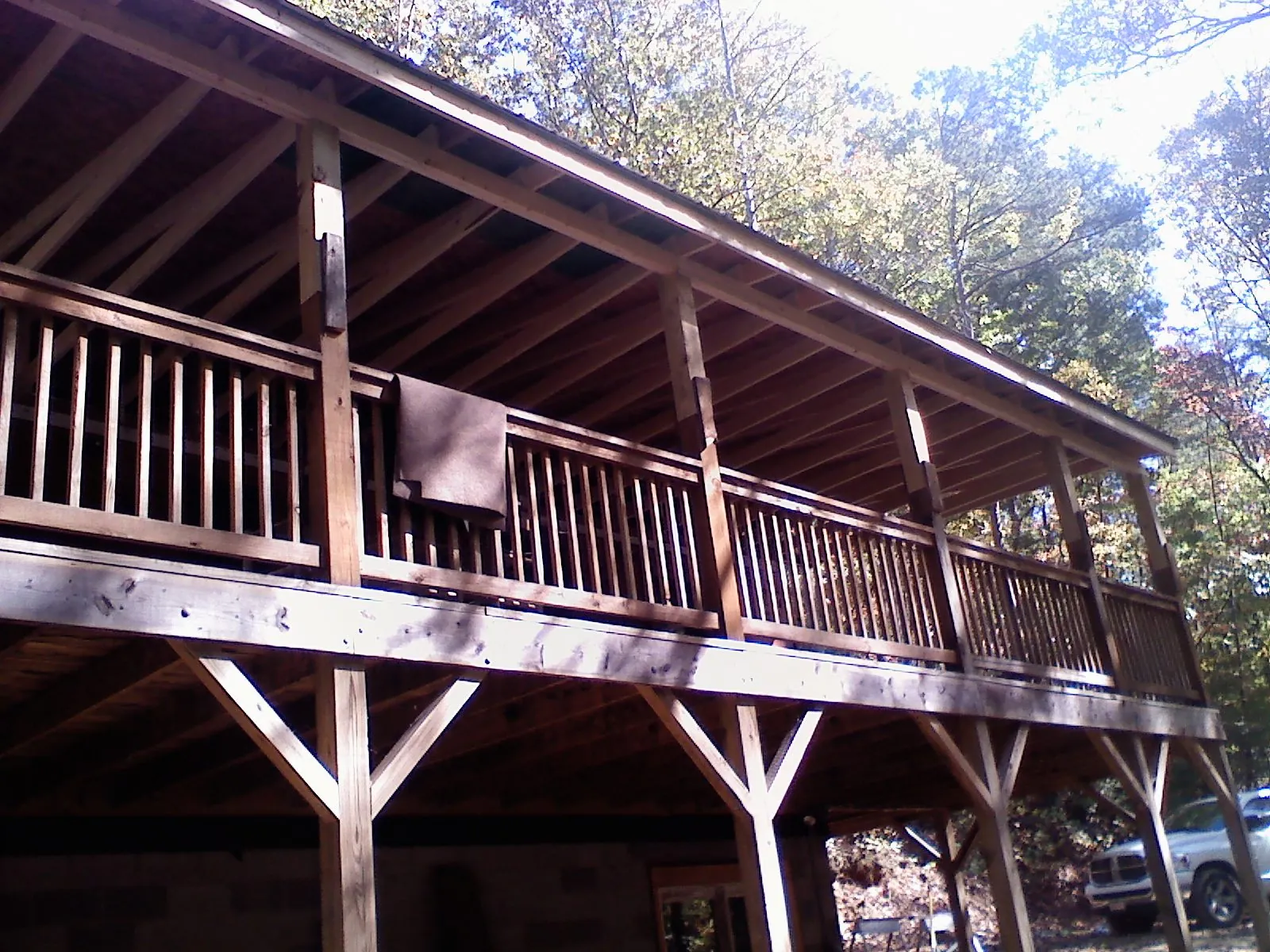 Timber framing under a new elevated porch and deck — Roof Leak Repair in Maine by Roofing Brothers